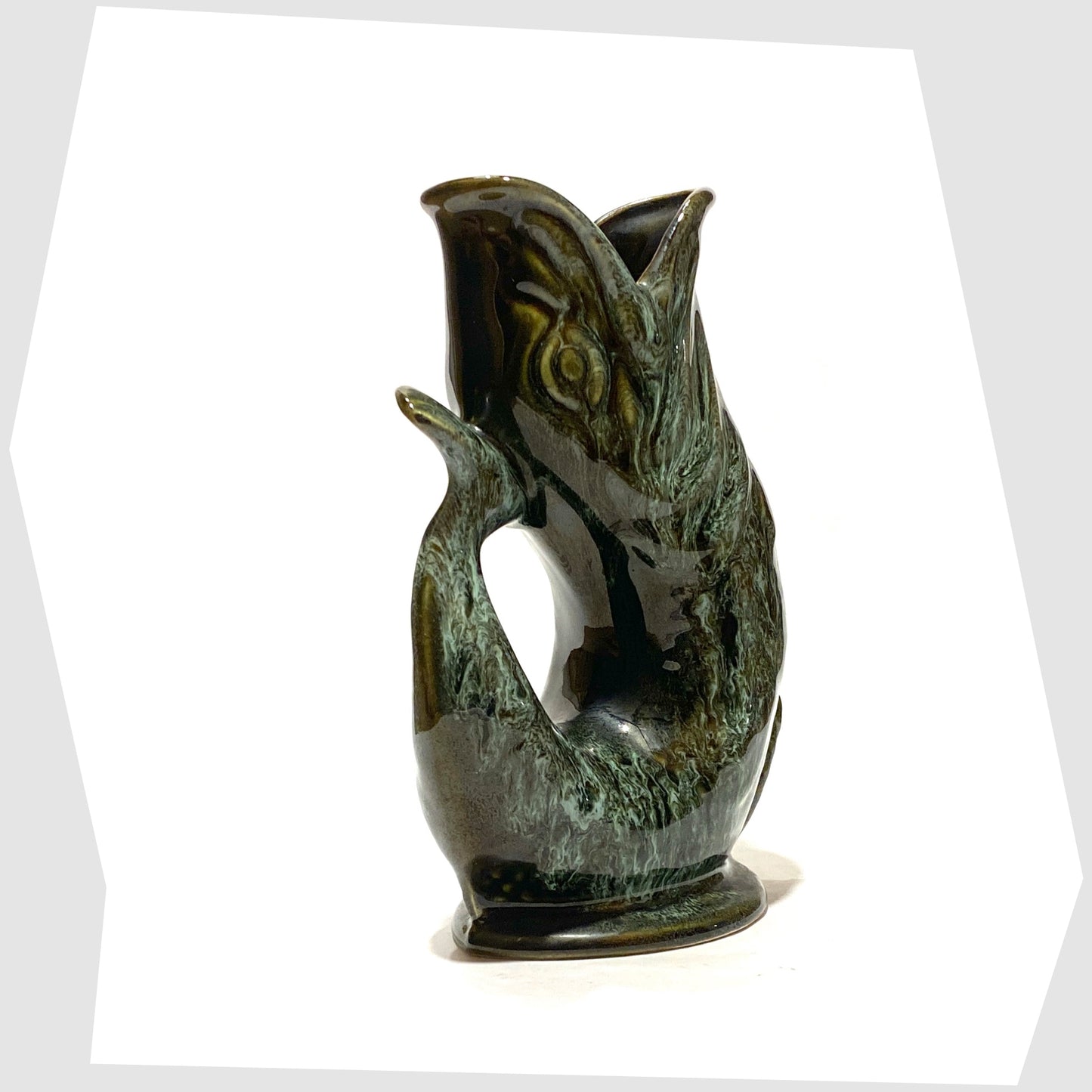 tail of the vintage fosters studio pottery gluggle jug in green drip glaze