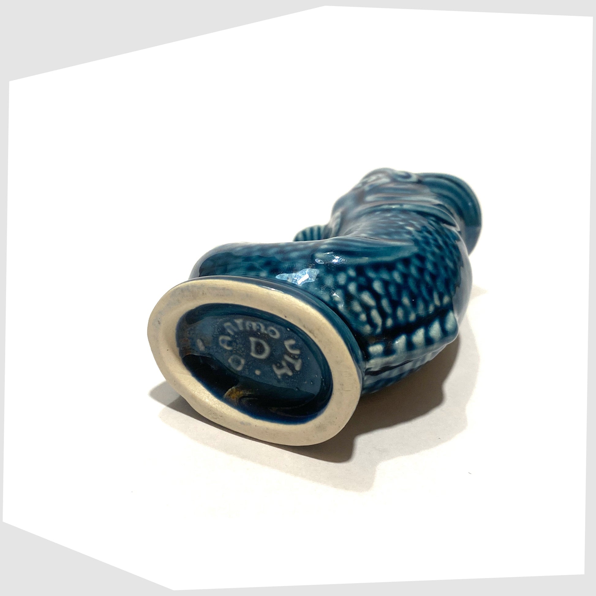 base stamp on the vintage Dartmouth Pottery Mini Gluggle Jug finished in a teal blue glaze