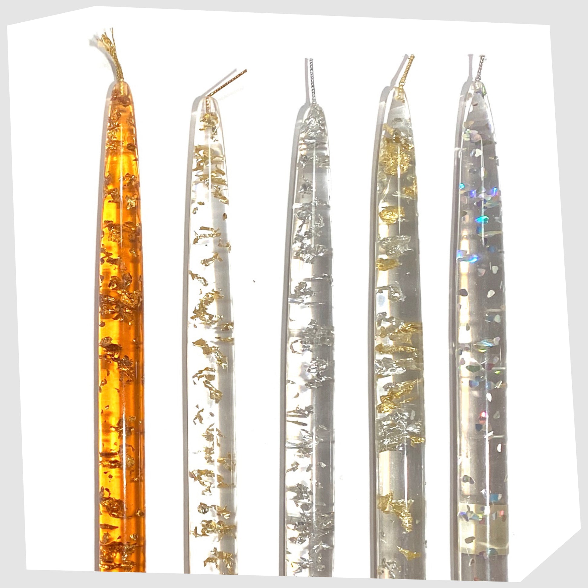 vintage nachtmann lucite candles in orange and clear acrylic lucite with various metal flecks