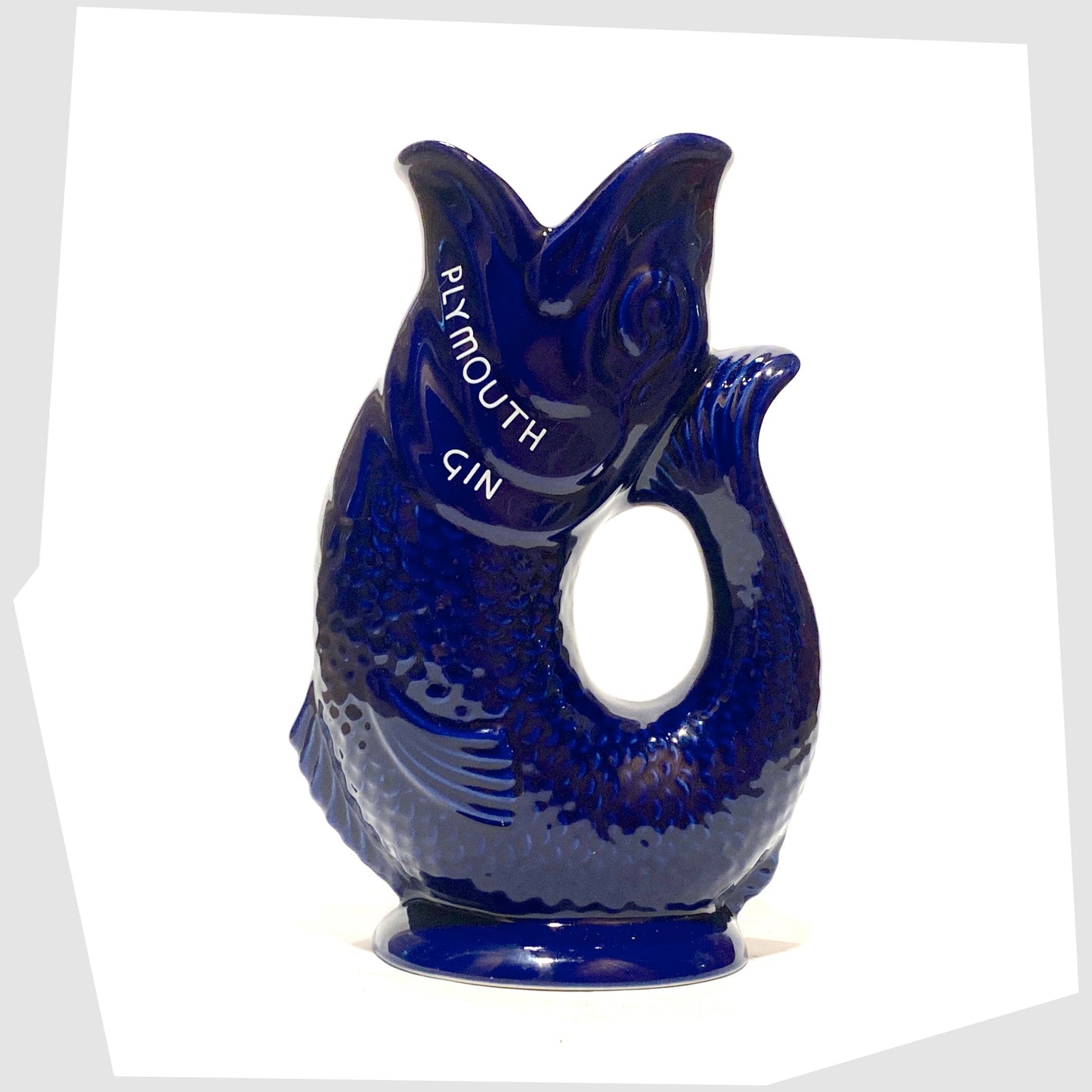 vintage artefact of wade ceramics, plymouth gin gluggle jug in cobalt blue glaze with white text