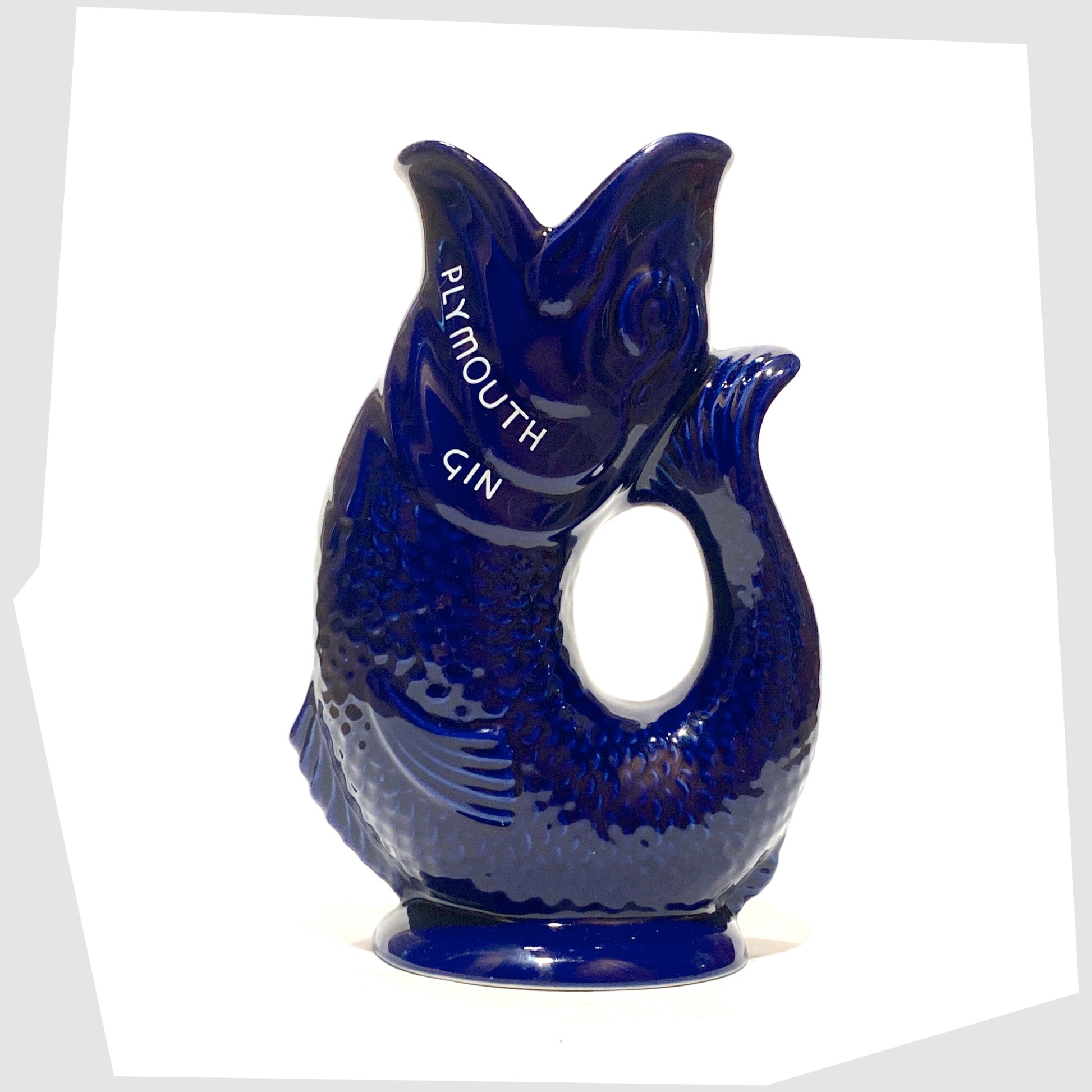 vintage artefact of wade ceramics, plymouth gin gluggle jug in cobalt blue glaze with white text