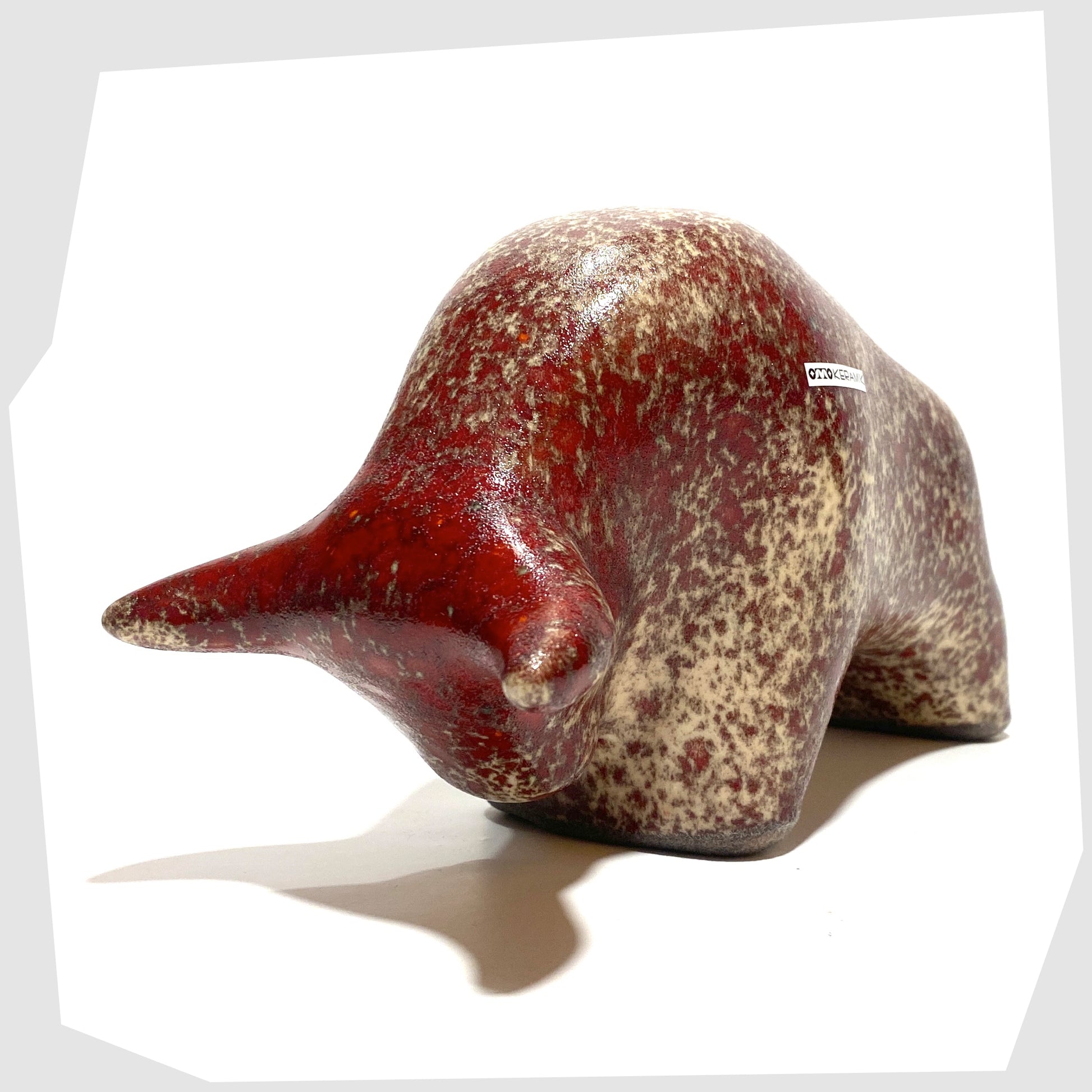 horns of the otto keramik bull in textured molten glaze of red and beige speckles 