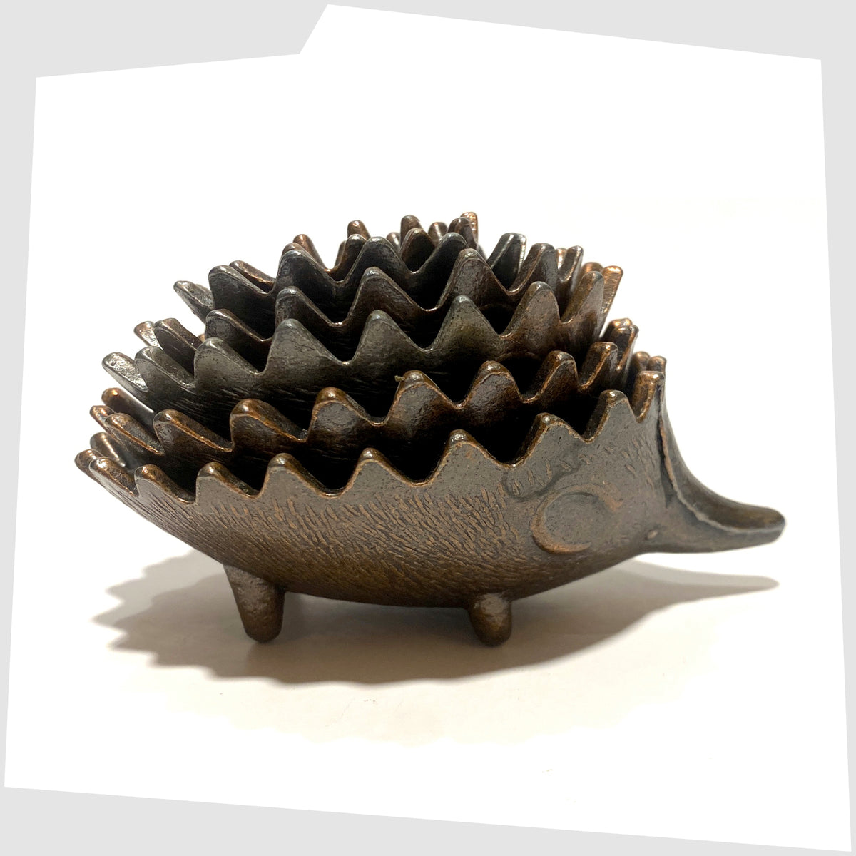 1960s Walter Bosse style Hedgehog Ashtray Set, shown stacked on a white background