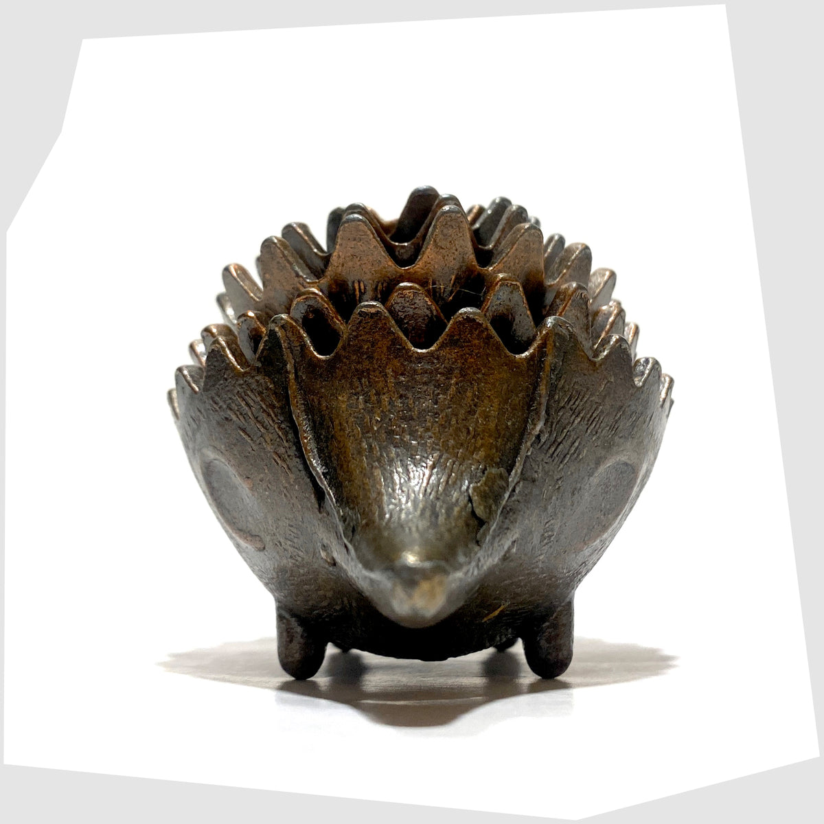 Front of the Walter Bosse style Hedgehog Ashtray Set, shown stacked on a white background