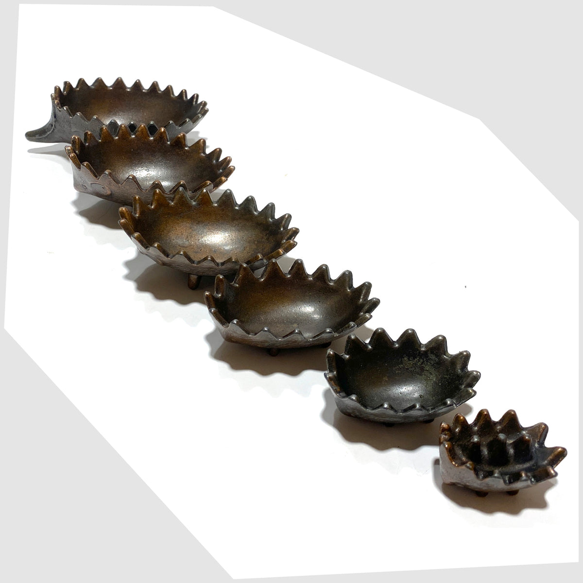 Walter Bosse style Hedgehog Ashtray Set, shown unstacked on a white background