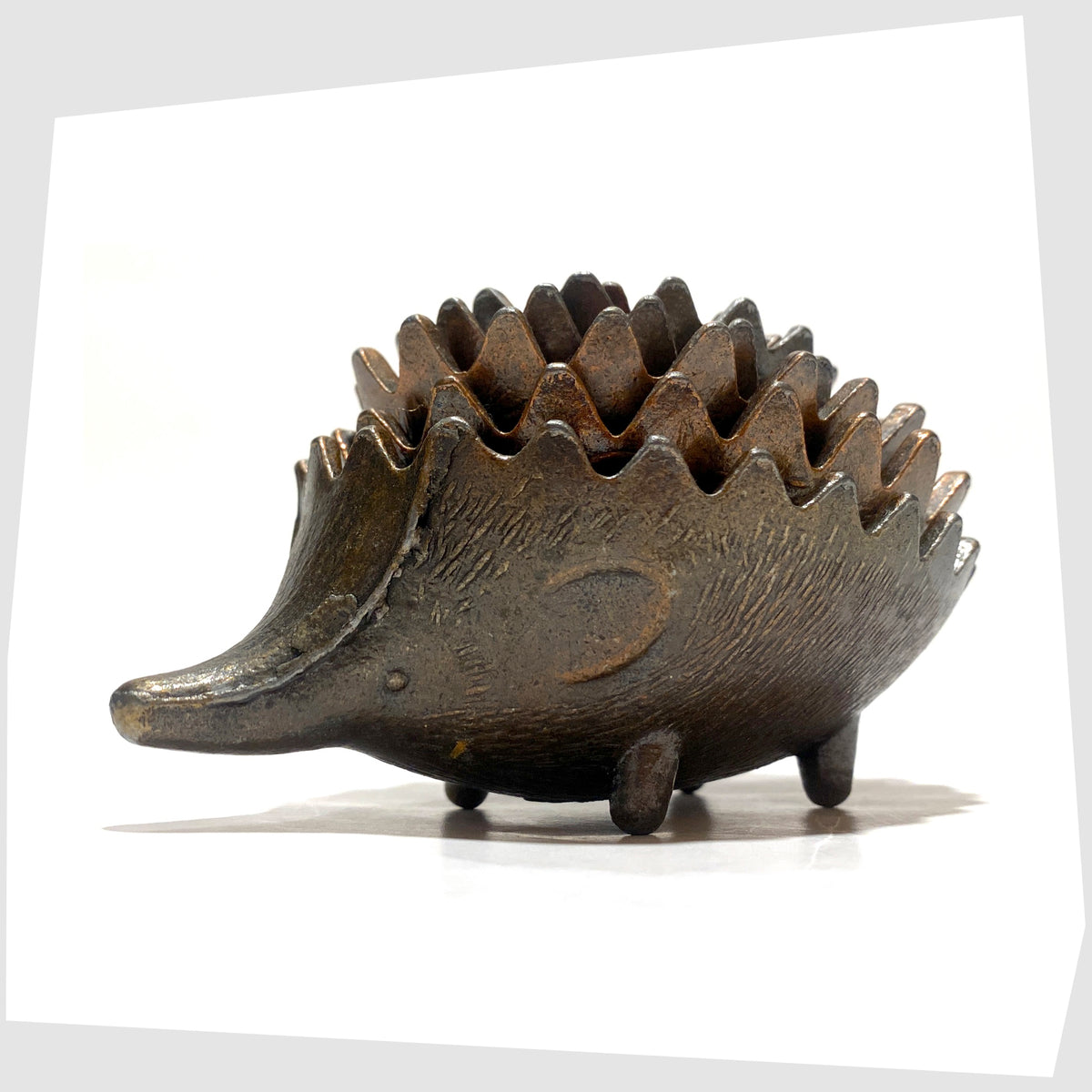 Mid-Century Walter Bosse style Hedgehog Ashtray Set, shown stacked on a white background