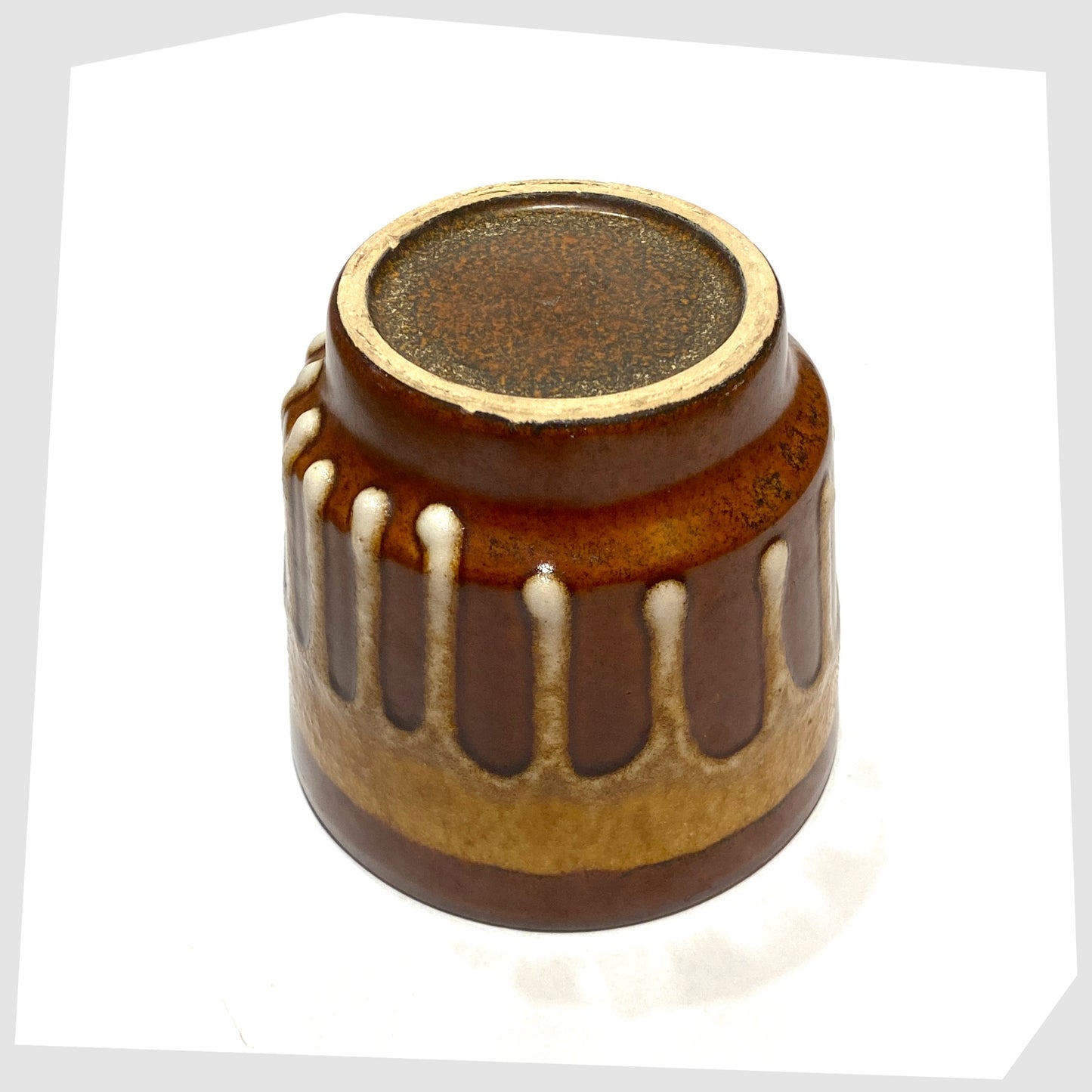 base of the West German Pottery Planter by Fohr Keramik in a chestnut and amber drip glaze