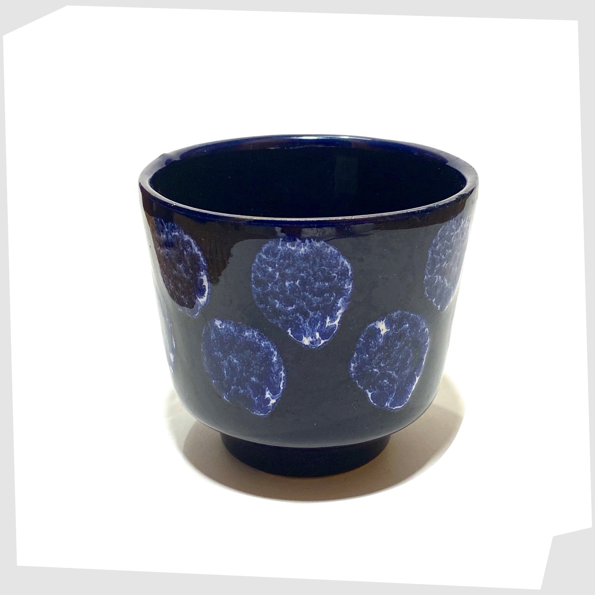 top rim of the vintage navy blue planter with white drip glaze spots