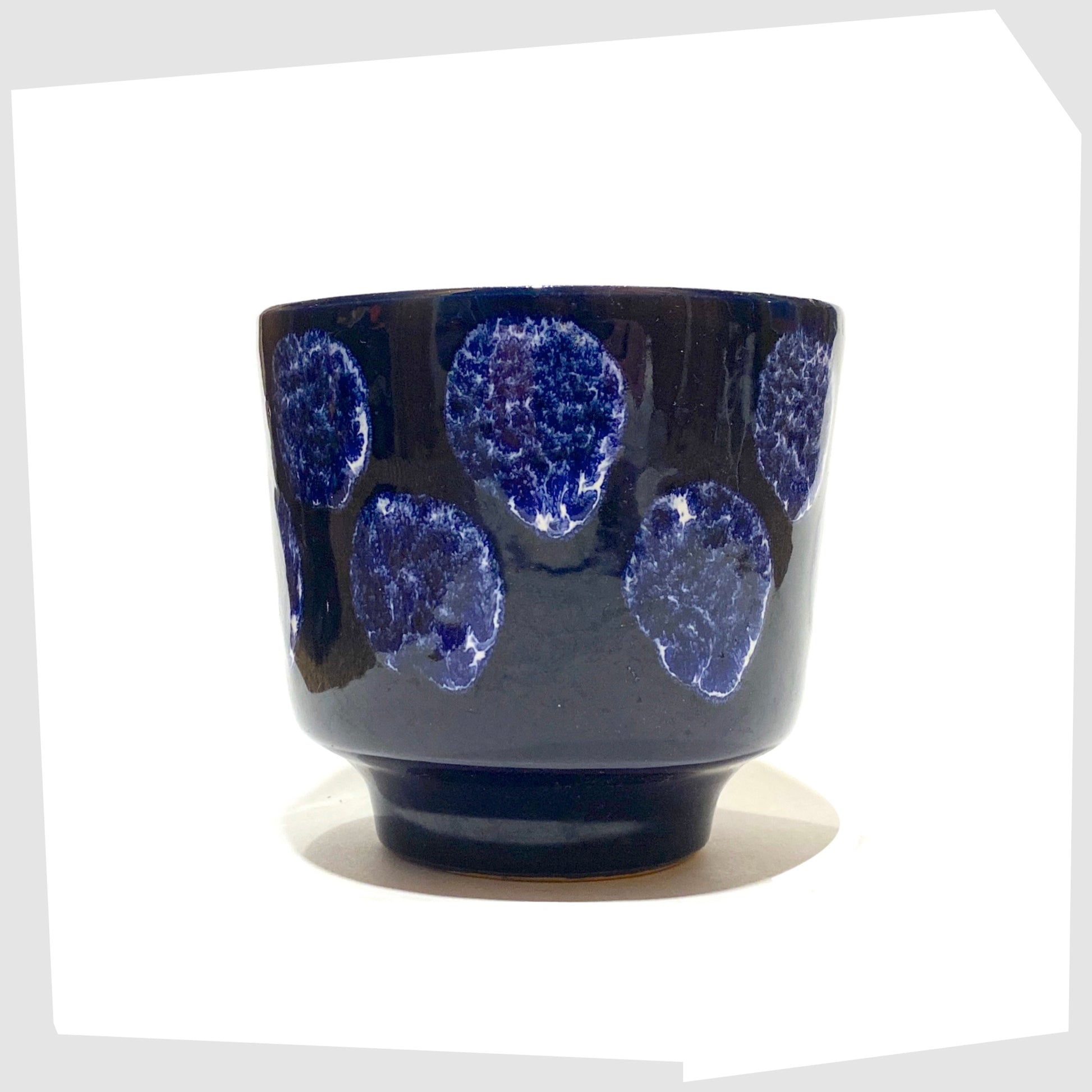 vintage navy blue planter with white drip glaze spots