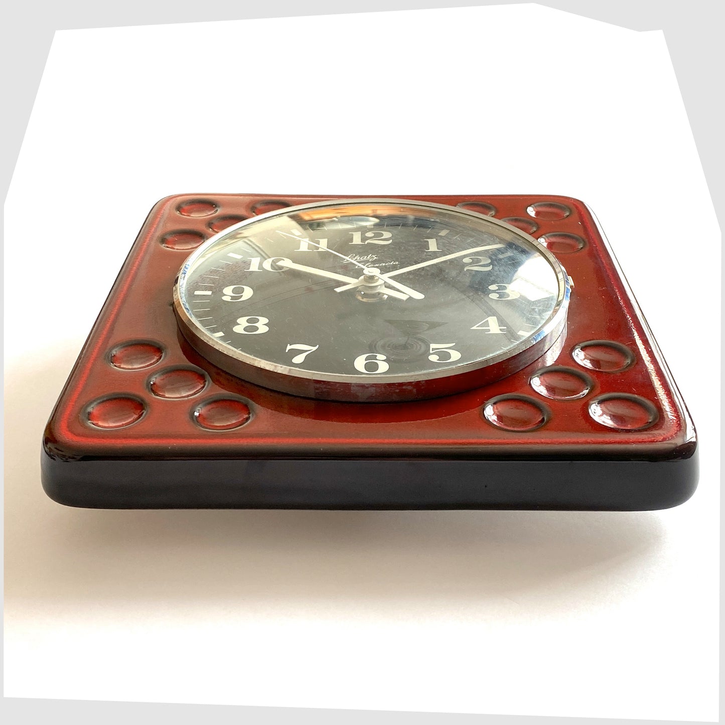 1970s west german pottery wall clock made of rich red ceramic with black and white dial