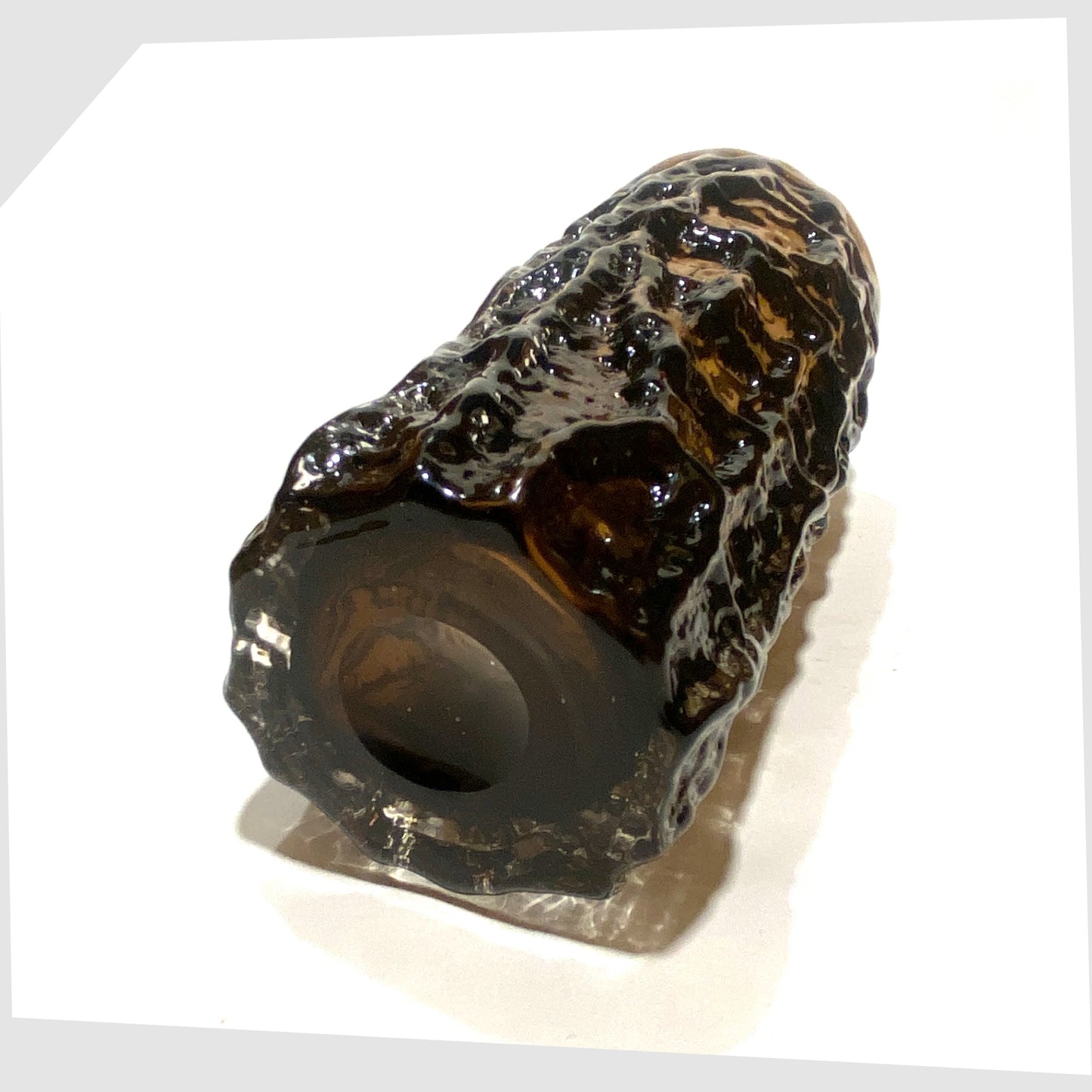 Underneath of the Whitefriars Glass Bark Vase (pattern 9690), designed by Geoffrey Baxter, finished in a cinnamon colour way, shown on a white background