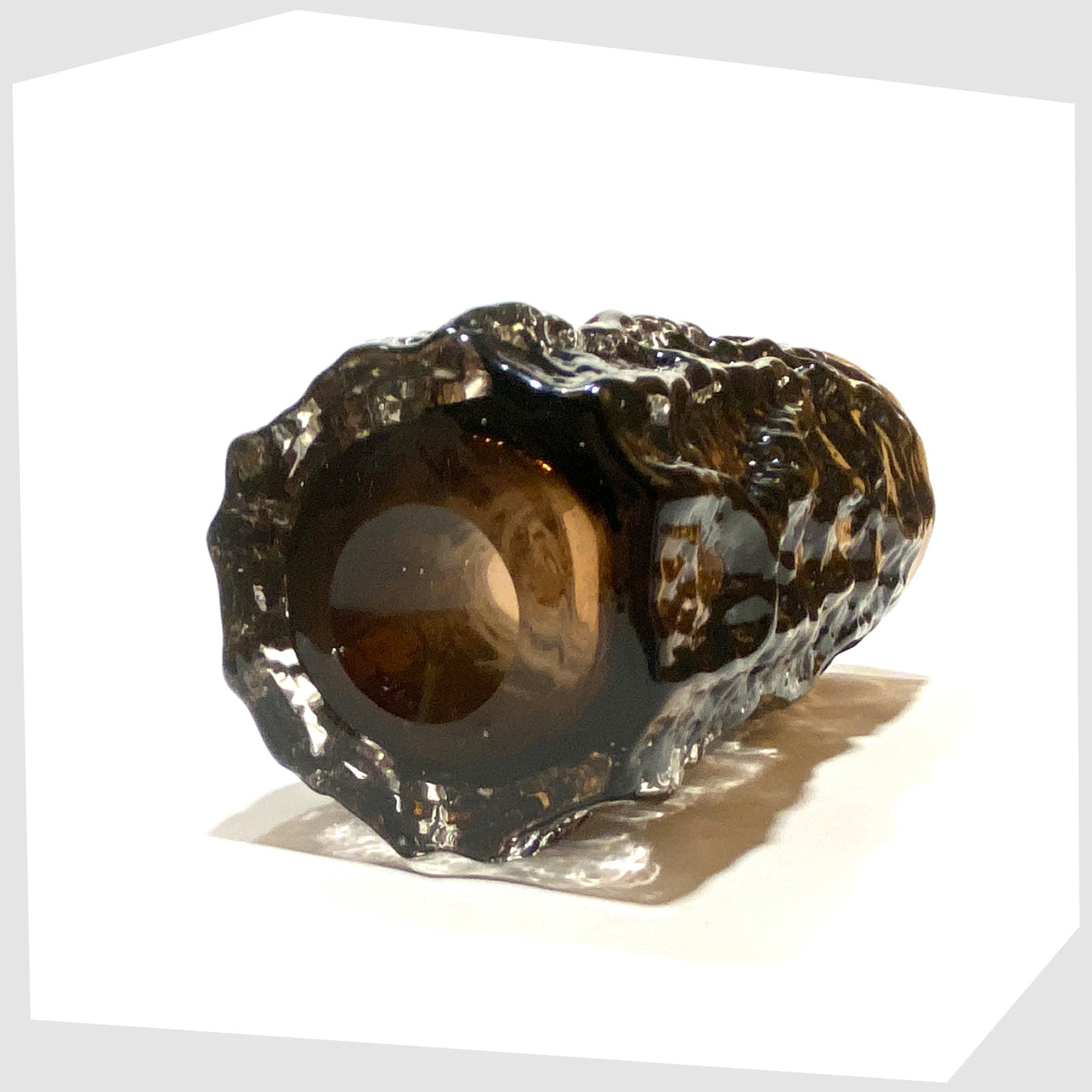 Base of the Whitefriars Glass Bark Vase (pattern 9690), designed by Geoffrey Baxter, finished in a cinnamon colour way, shown on a white background