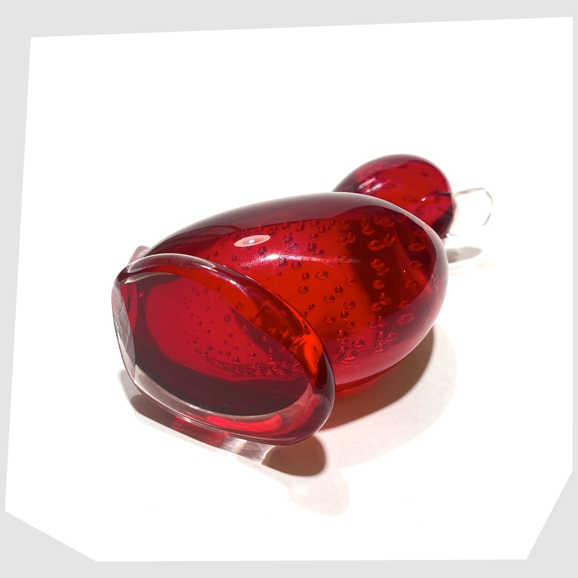 base of the whitefriars glass dilly duck ornament in ruby red glass with controlled bubbles