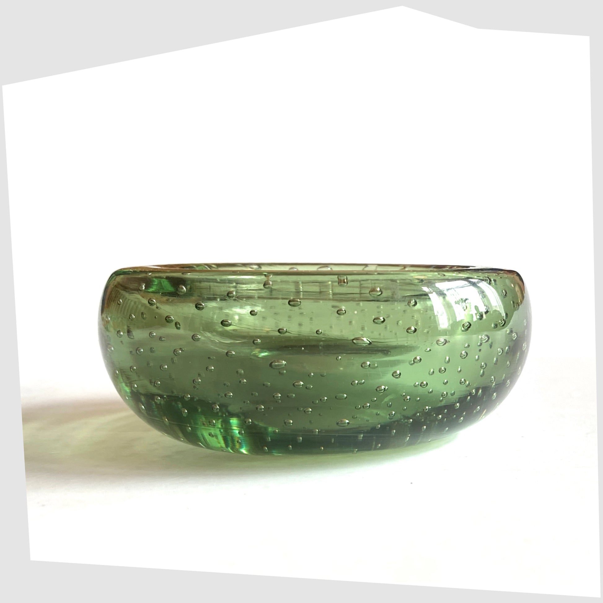 Side profile of the Whitefriars Controlled Bubble Dish in Green Glass