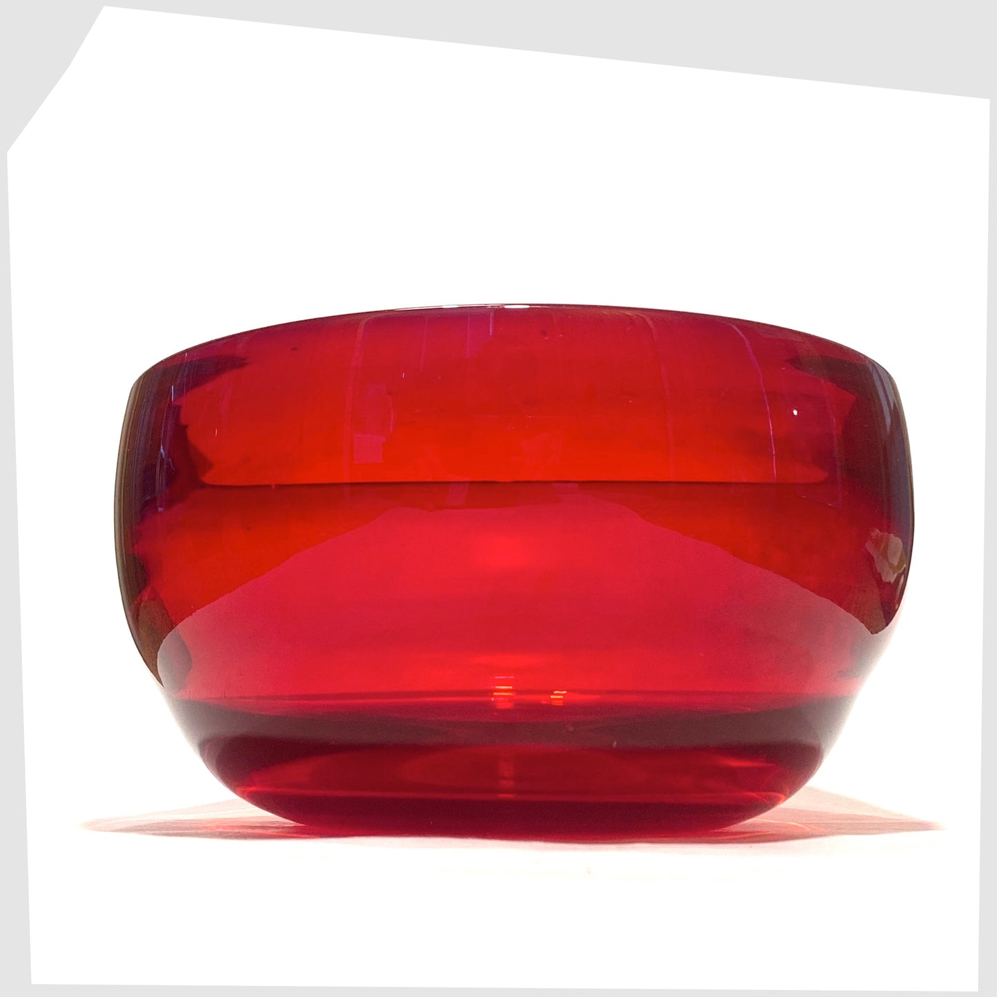 1960s Whitefriars Glass Optical Bowl in ruby red glass, shown on a white background