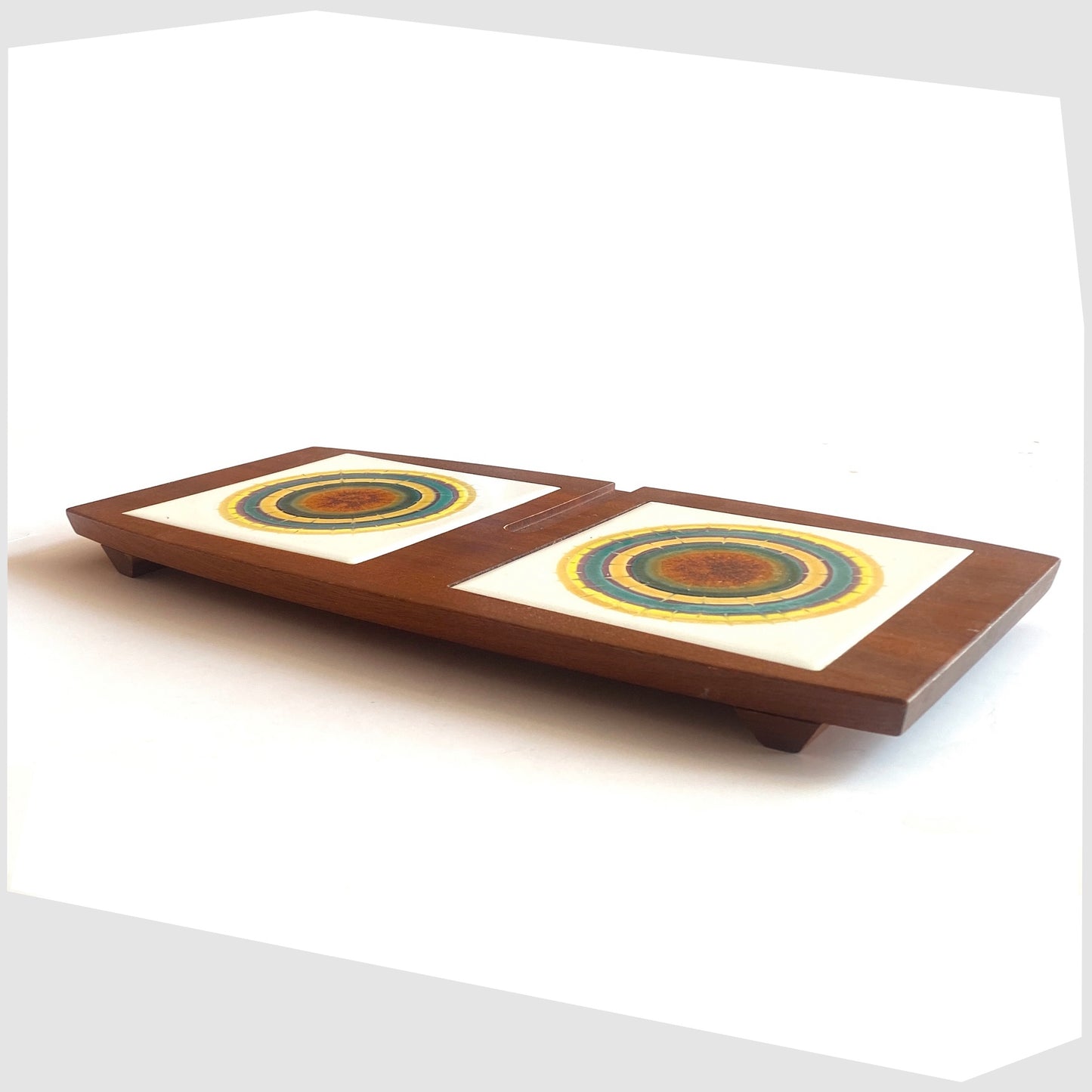 Side profile of the Wyncraft Serving Tray made of teak woodd with matching pair of Alan Wallwork Ceramic Tiles, shown on a white background