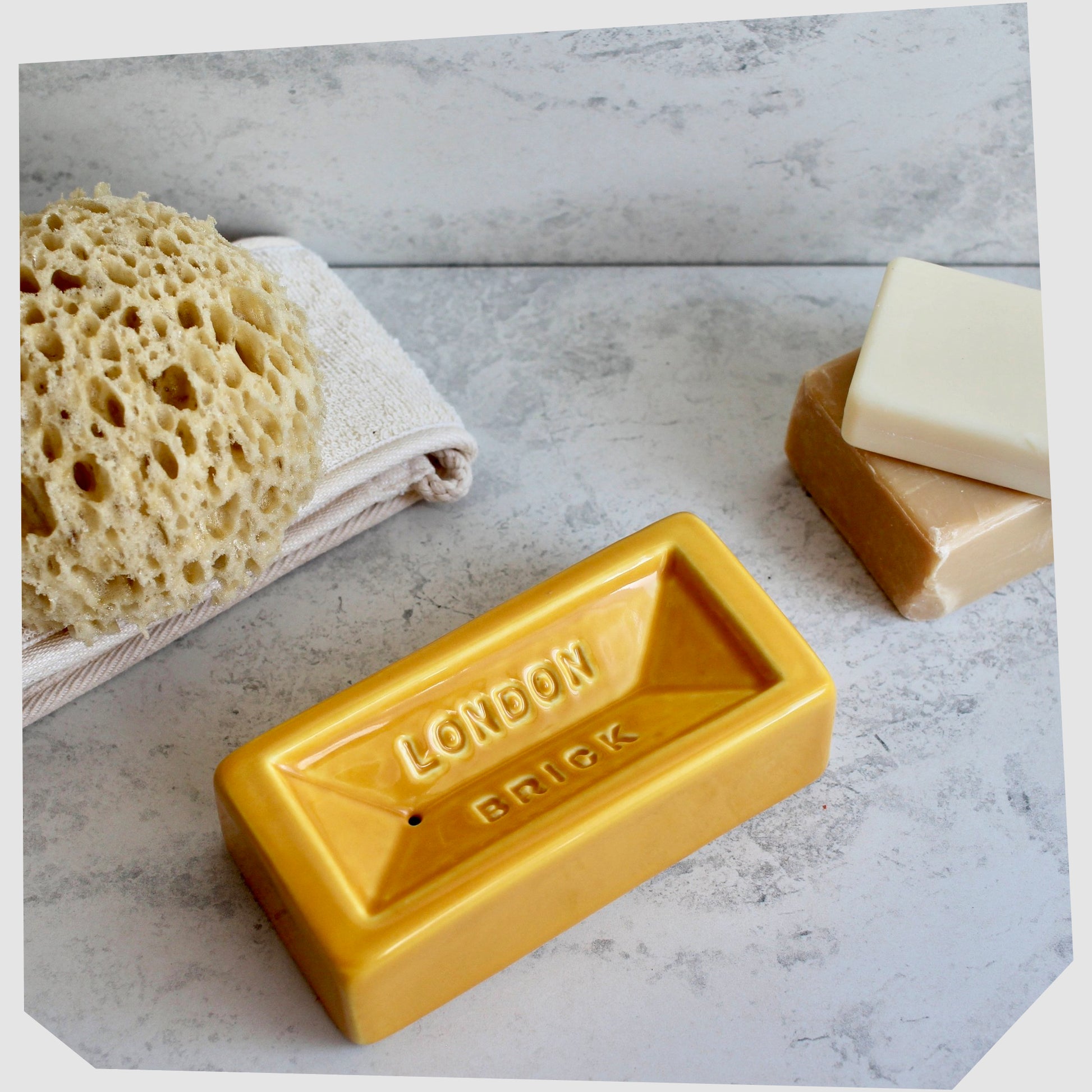 london-brick-soap-dish-by-stolen-form-made-from-yellow-glazed-ceramic