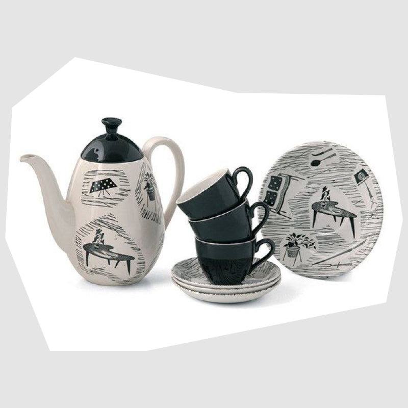 collection of homemaker ceramics including a coffee pot, cup and saucers and side plate