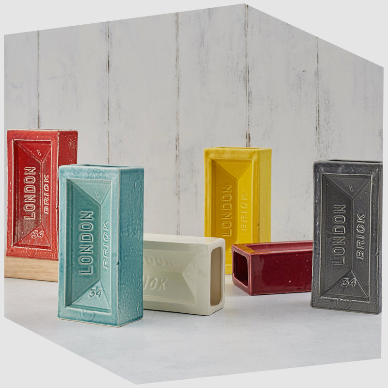 collection-of-london-brick-vases-by-stolen-form-in-red-blue-white-yellow-and-grey